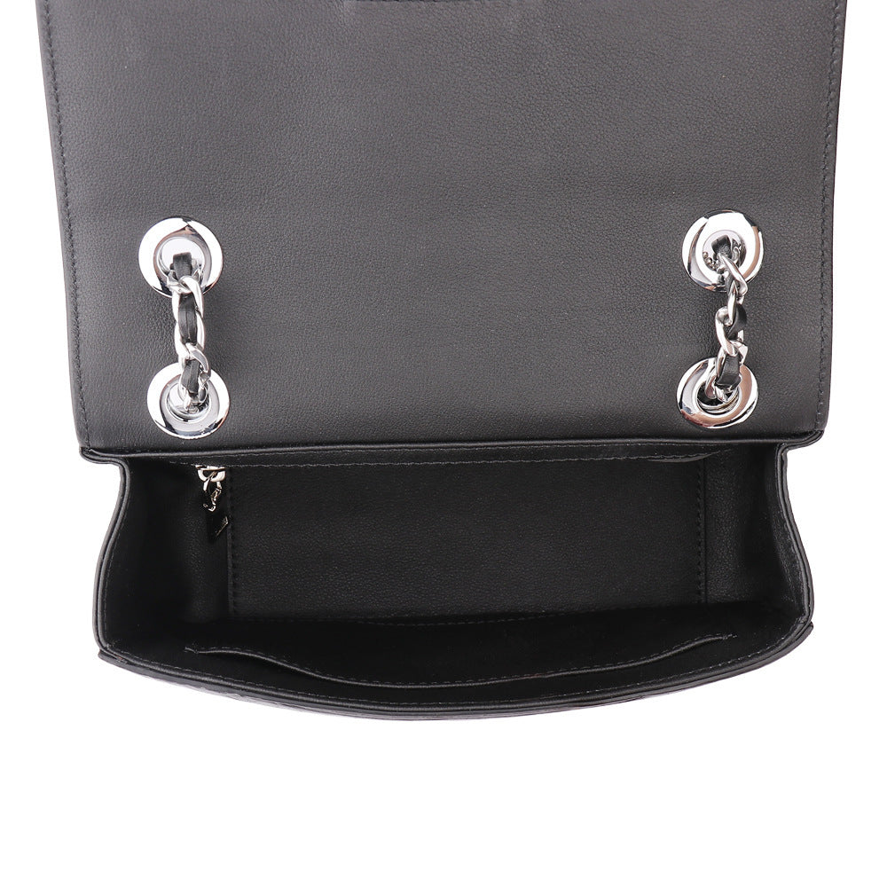 Black handbag with silver chain details on a white background