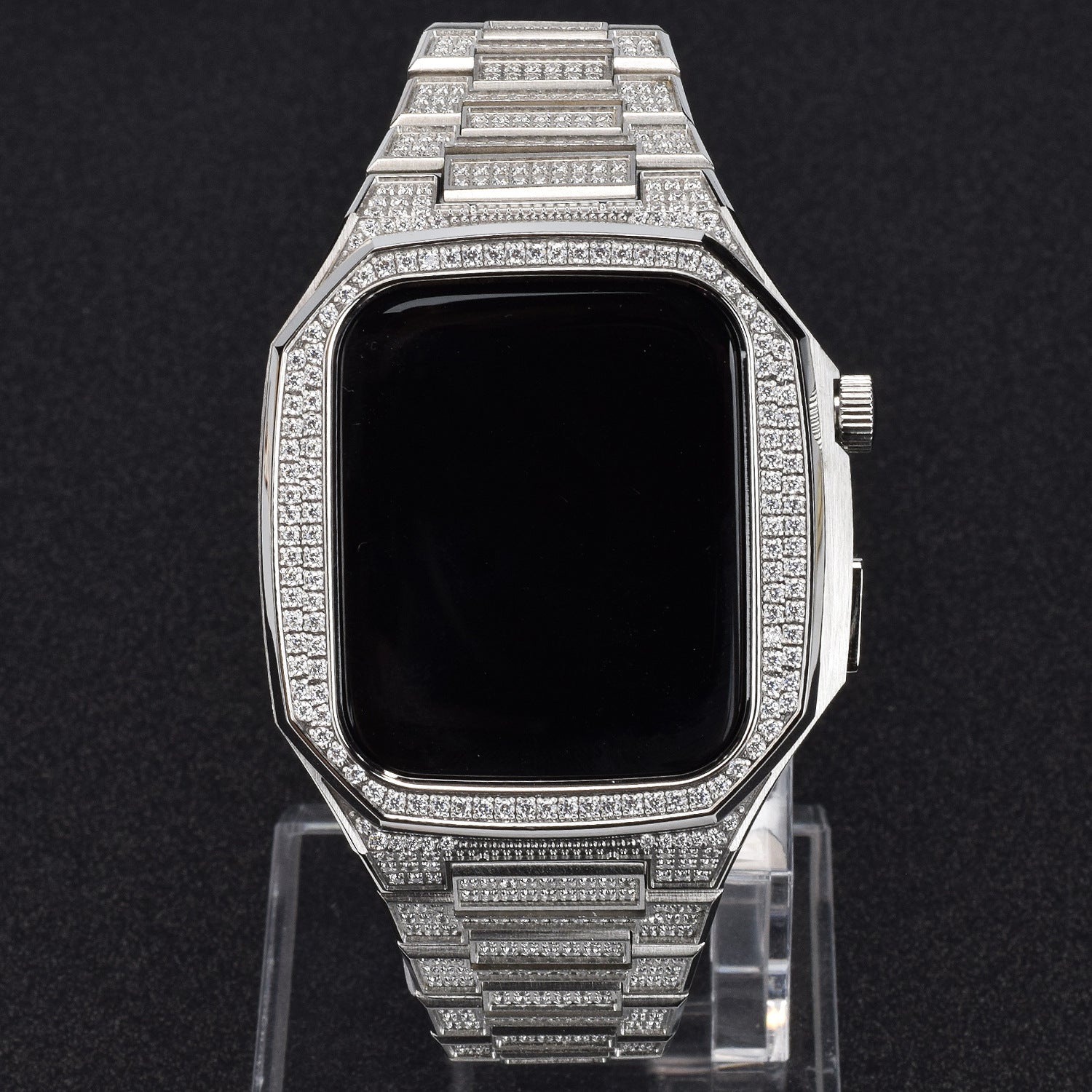 Luxury silver smartwatch with diamond-studded band on a black background