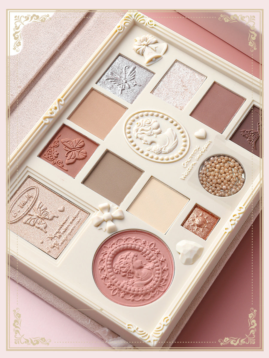 Makeup palette with decorative elements on a pink background