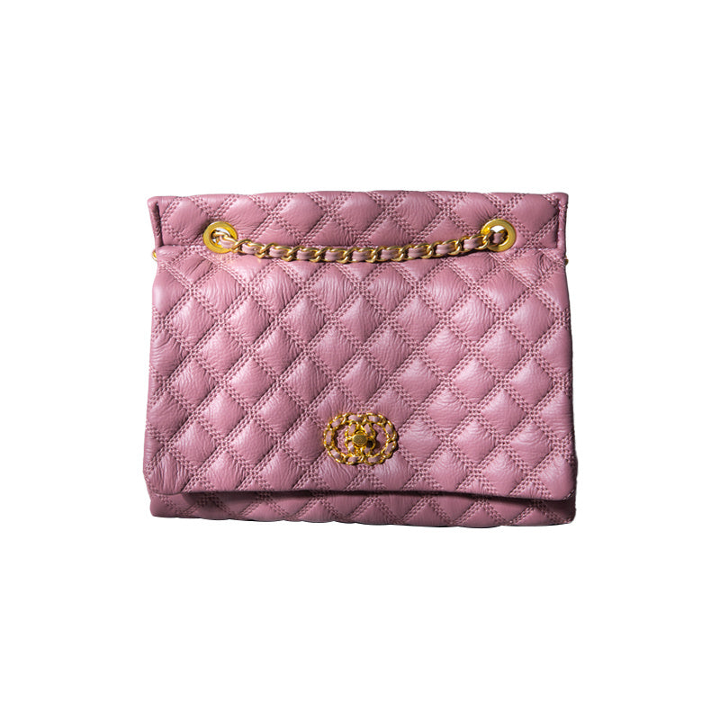Pink quilted handbag with gold chain and clasp on a white background
