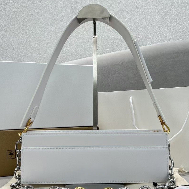 White handbag with a chain detail on a light gray background