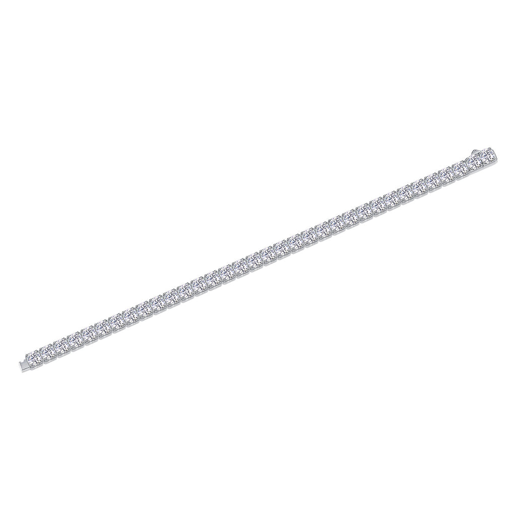 Silver bracelet with clear stones on a white background