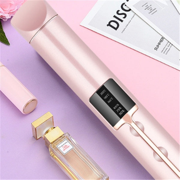 Digital thermometer and perfume bottle on a pink and purple gradient background