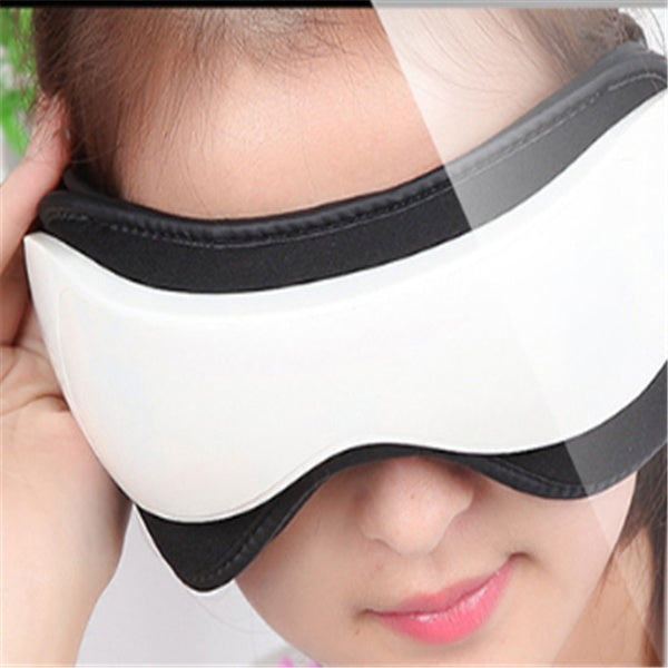 Person wearing a white eye mask with black straps.