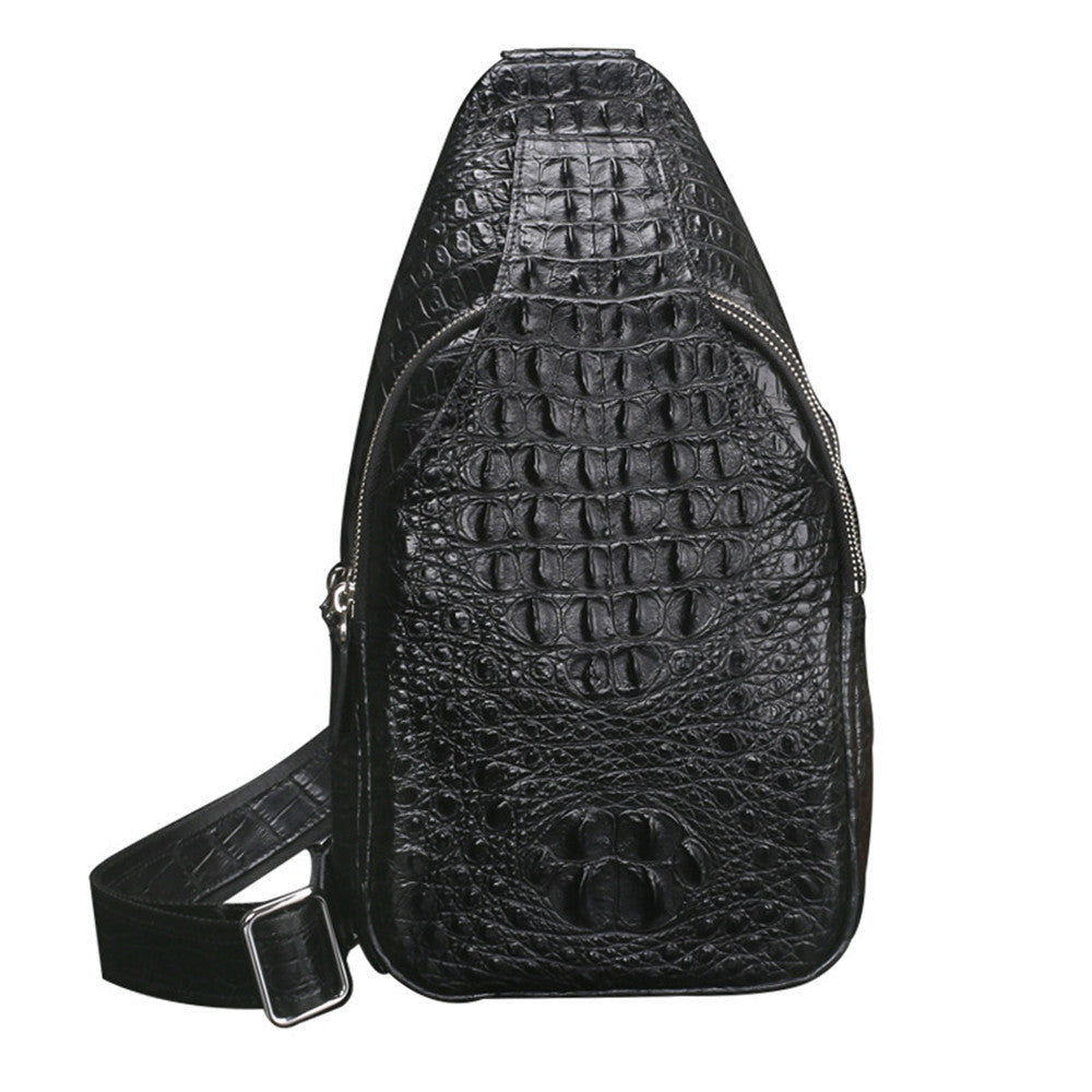 Black crocodile-patterned sling bag on a white background