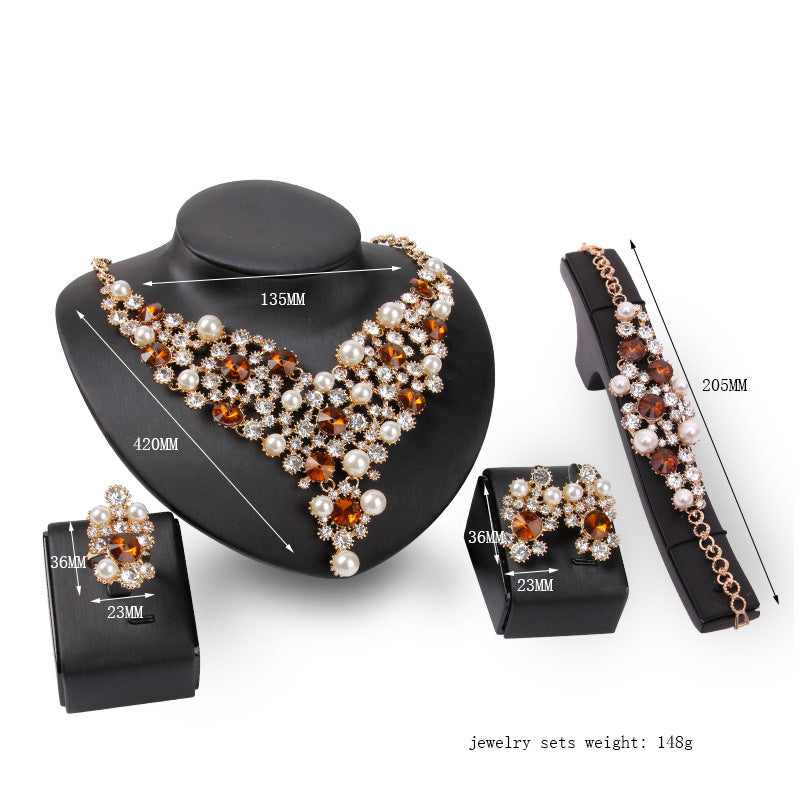 Jewelry set with necklace, bracelet, and earrings on a white background