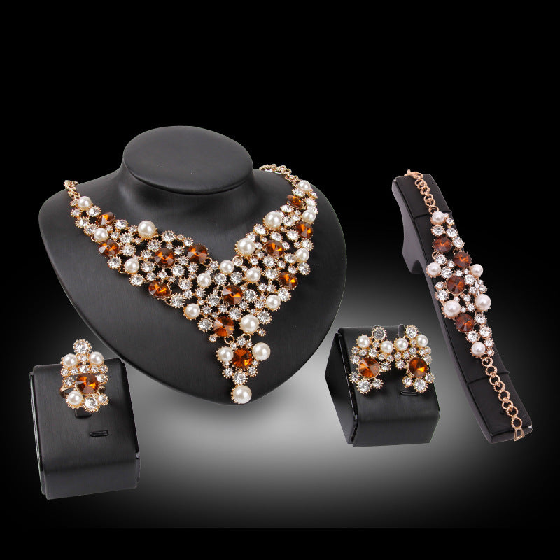 Jewelry set with necklace, bracelet, and earrings on a black background