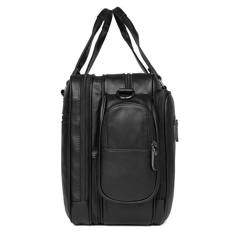 Black backpack with multiple compartments on a white background