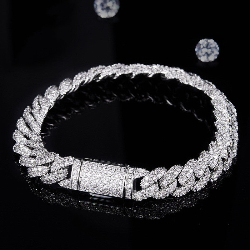 Silver bracelet with diamond accents on a black background