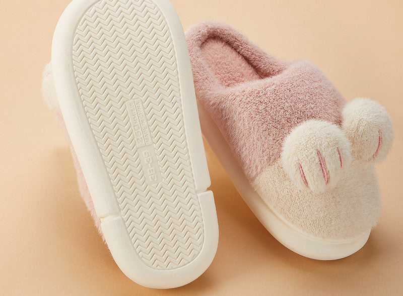 Pink slippers with a soft texture on a beige background