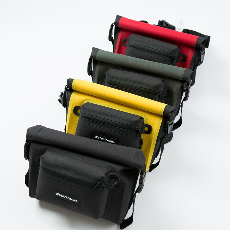 Set of five waterproof bags in black, yellow, green, and red on a white background.