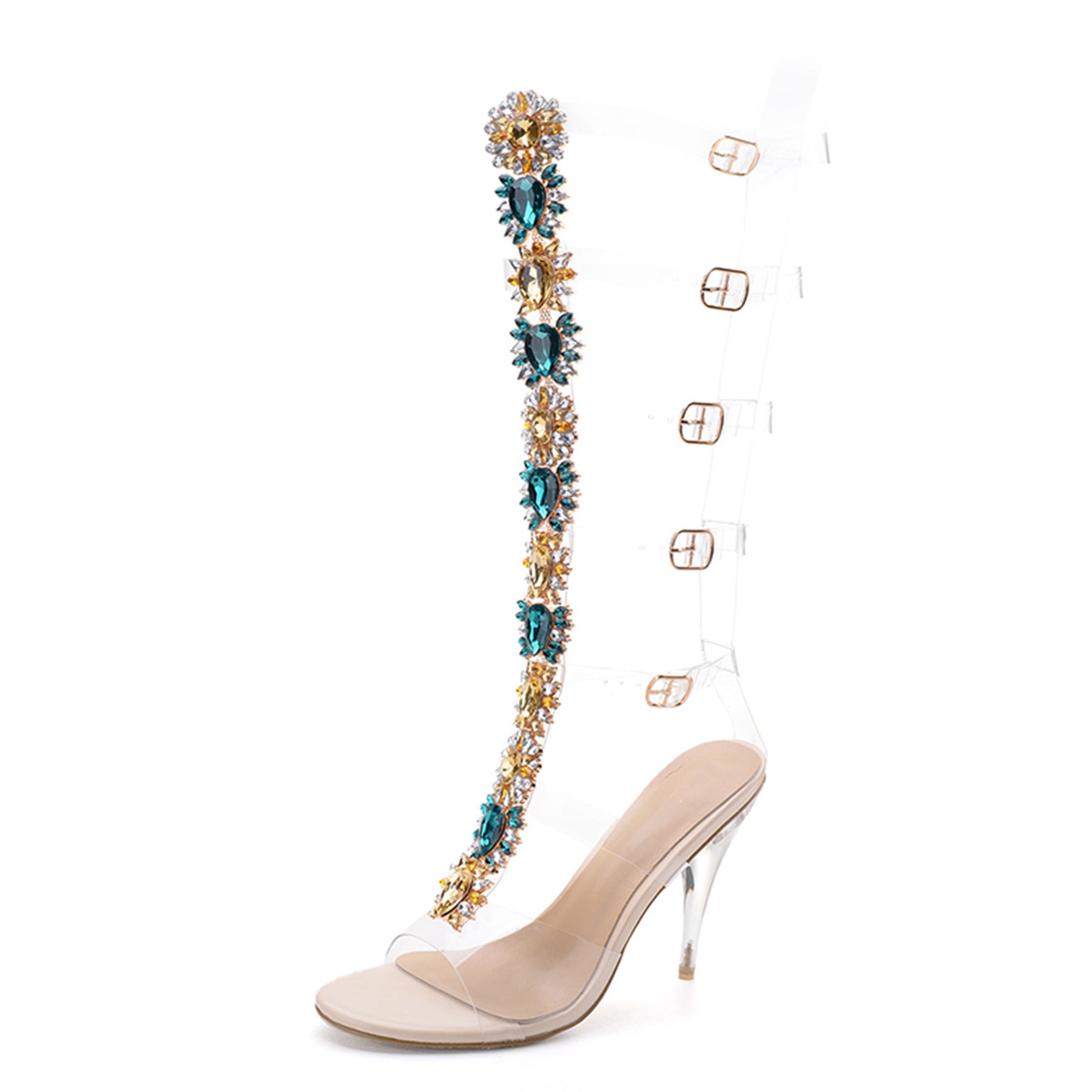 Beige high-heeled shoe with a decorative strap featuring blue and gold crystals on a white background