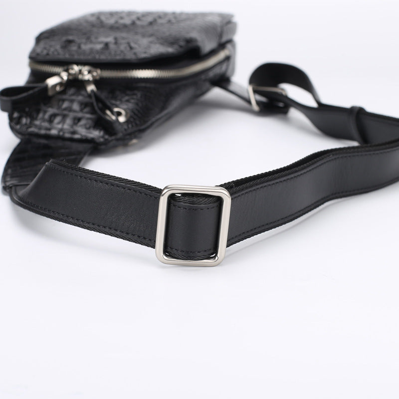 Black leather bag with a strap on a white background