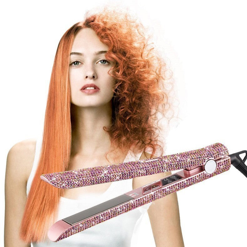 Woman with styled hair holding a pink hair straightener against a white background