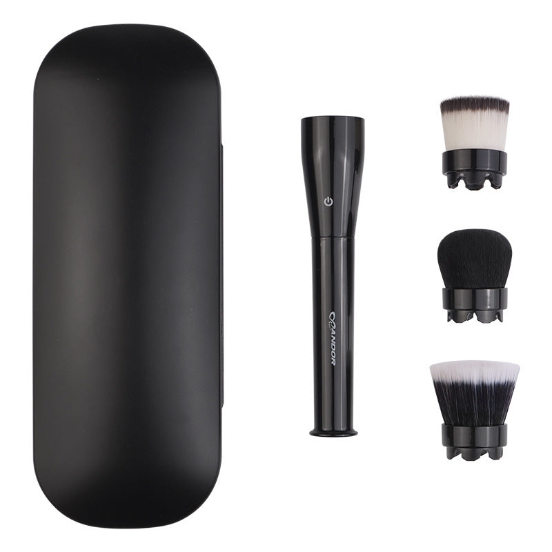 Set of black makeup brushes with a holder on a white background