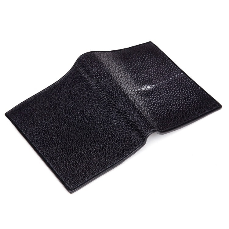 Black textured wallet on a white background