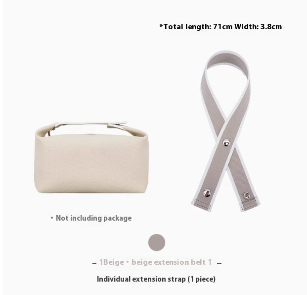 Beige handbag with an extension belt on a white background