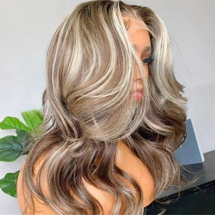 Mannequin head with a wig featuring brown and blonde hair on a white background.