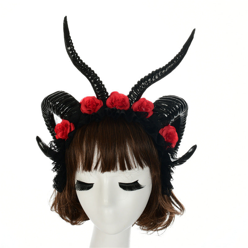 Black horned headband with red roses on a mannequin head against a white background