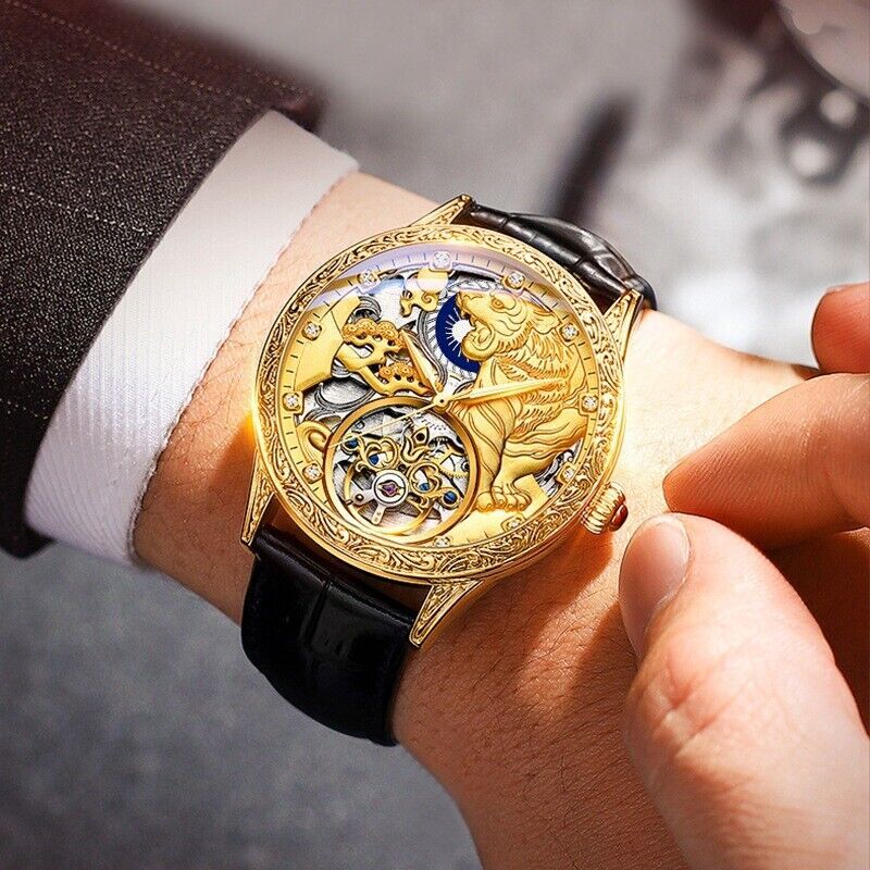 Luxury gold watch with intricate design on a person's wrist