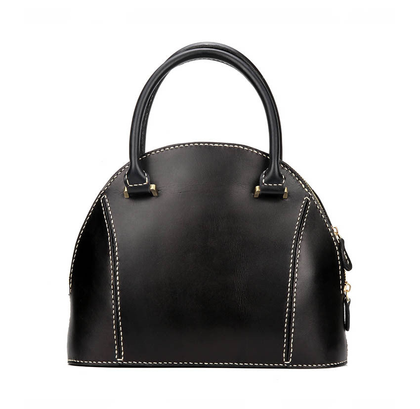 Black handbag with gold accents on a white background