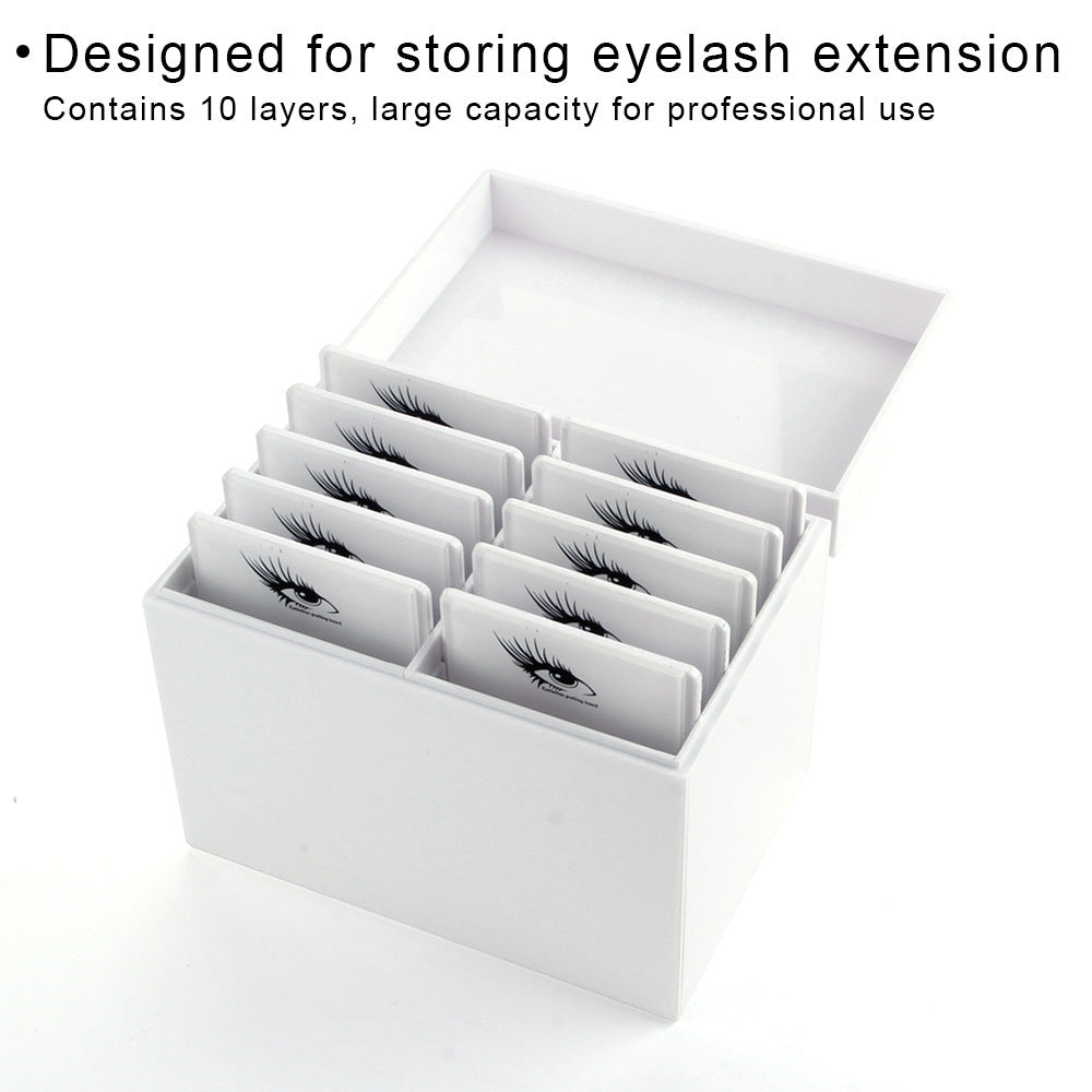 Eyelash extension storage box with multiple compartments on a white background