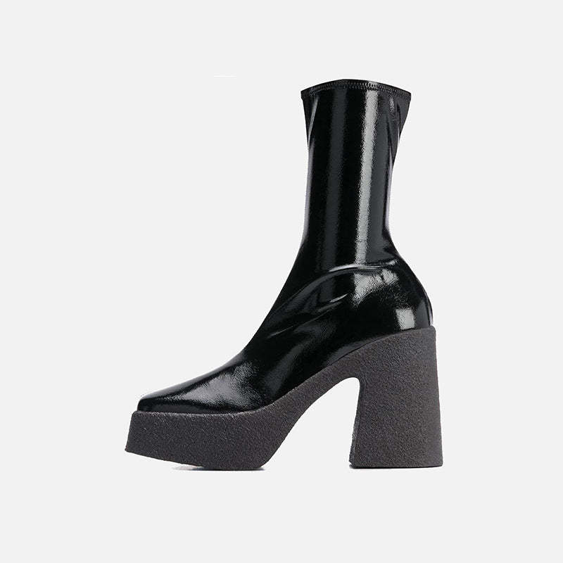 Black platform boot on a white background