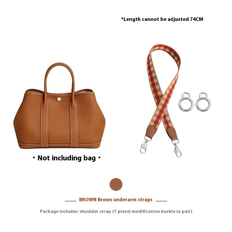 Brown handbag with a checkered strap and two hooks on a white background