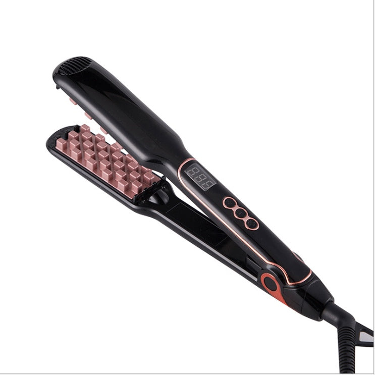 Black and rose gold hair straightener on a white background