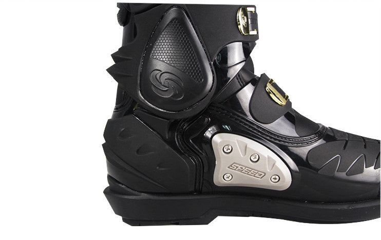 Black motorcycle boot with visible brand logo on a white background