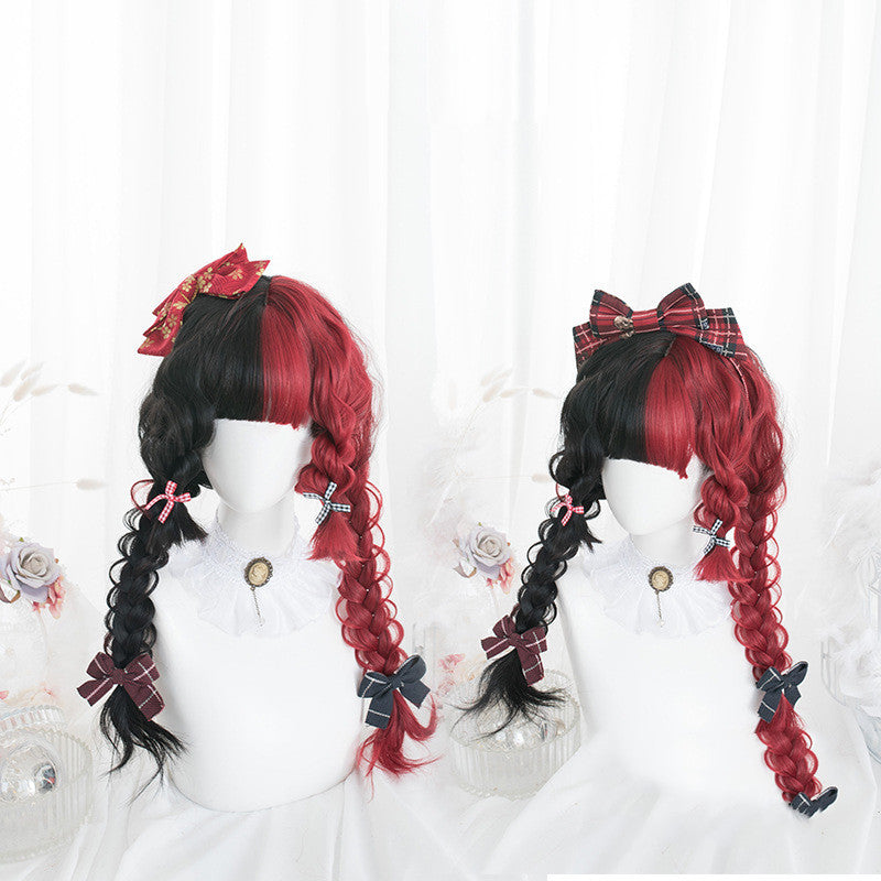 Two mannequin heads with black and red wigs styled in braids with decorative bows on a white background.