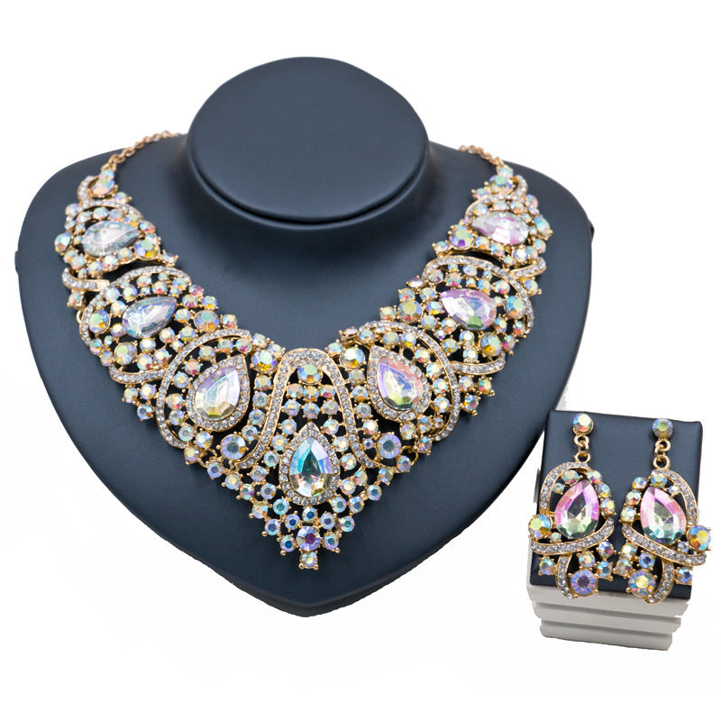 Jewelry set with a necklace and earrings on a black stand