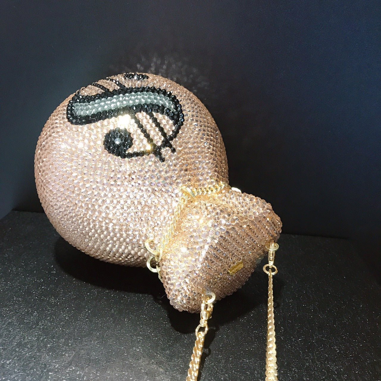 Decorative boxing glove with eye design on a dark background