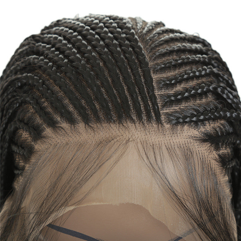 Close-up of braided hair with a neutral background