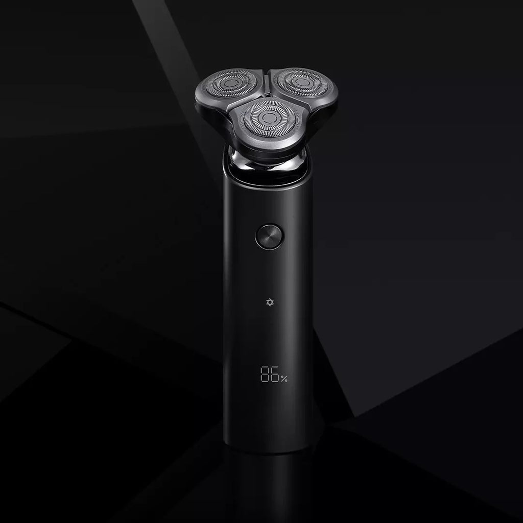 Black electric shaver on a dark background