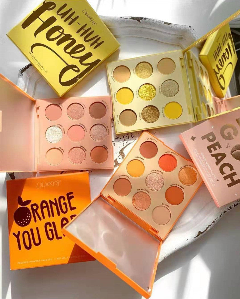 Makeup palettes with colorful shades and visible brand names on a white background