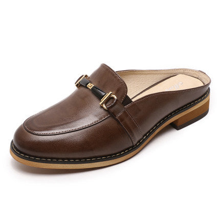 Brown leather mule shoe with a strap on a white background