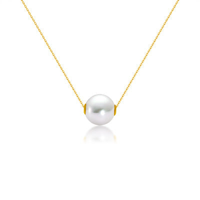 Pearl necklace with gold chain on a white background