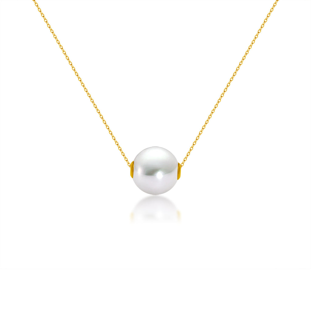 Pearl necklace with gold chain on a white background