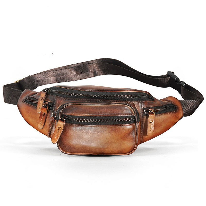 Brown leather waist bag with a black strap on a white background