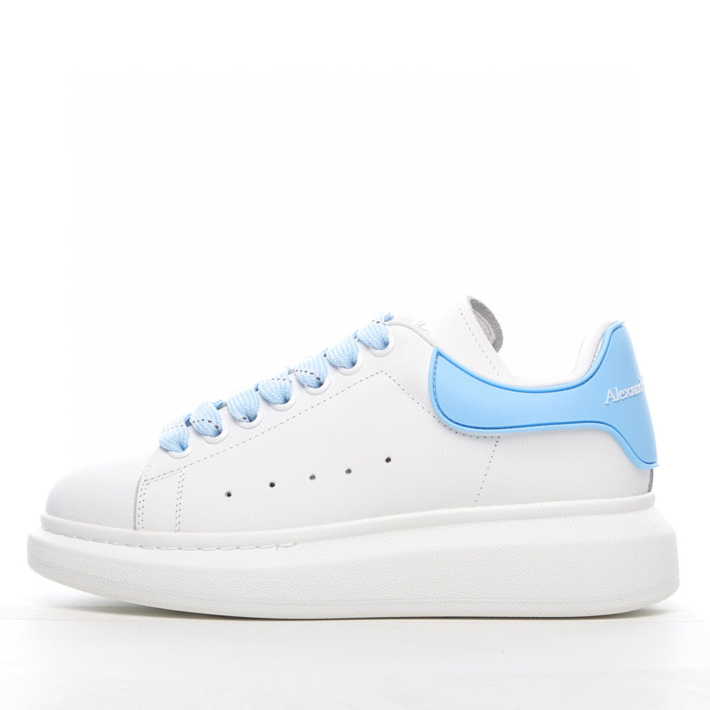 White sneaker with light blue accents on a white background