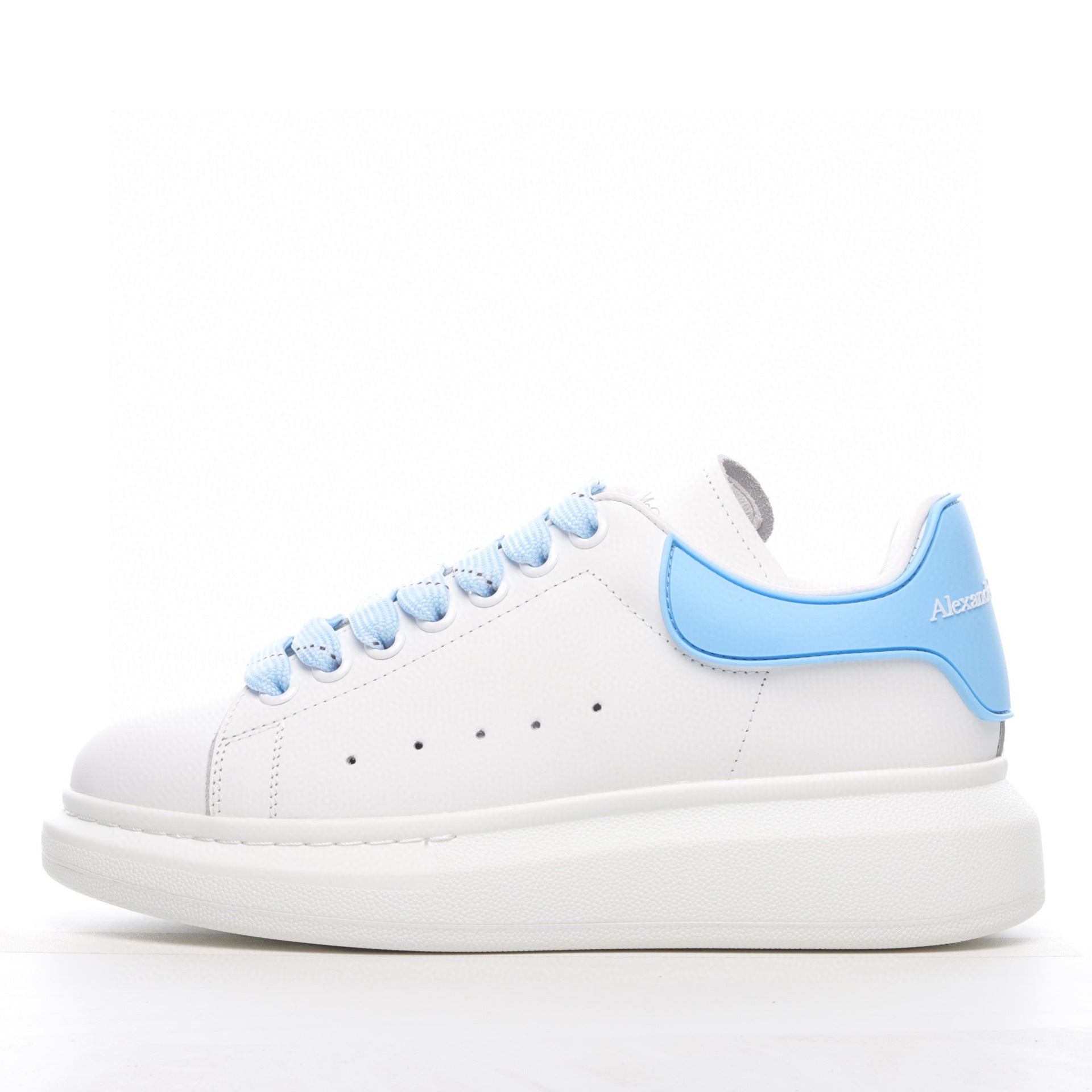 White sneaker with light blue accents on a white background