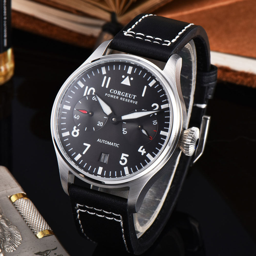 Corgeut watch with black leather strap and black dial on a dark background