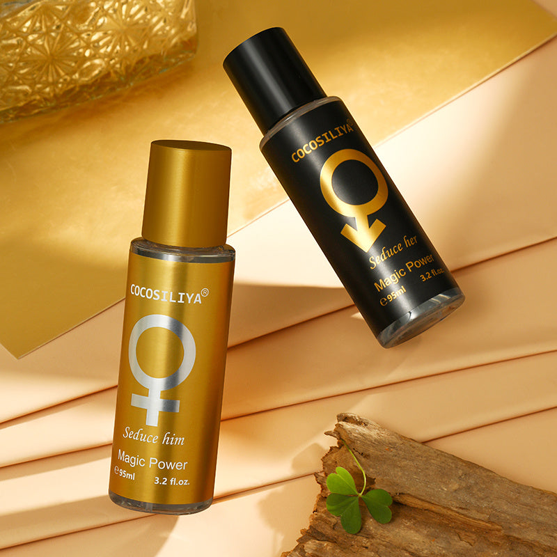 Two COCOSILIYA perfume bottles on a wooden surface with a gold background