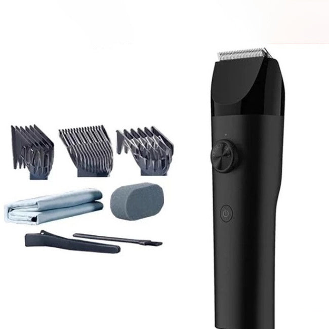 Black hair trimmer with attachments on a white background