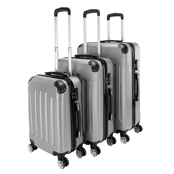 Set of three silver suitcases with black handles and wheels on a white background