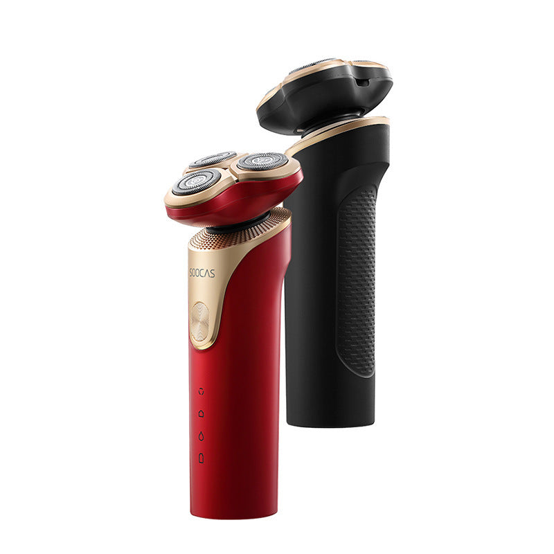 Red and black electric shaver on a white background