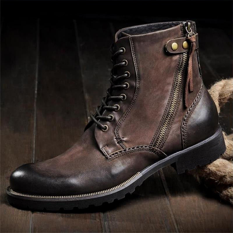 Brown leather boot with a zipper on a dark background