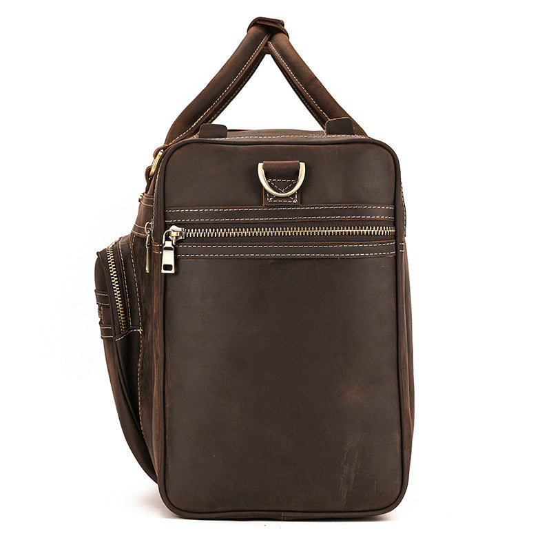 Brown leather bag with zippers on a white background