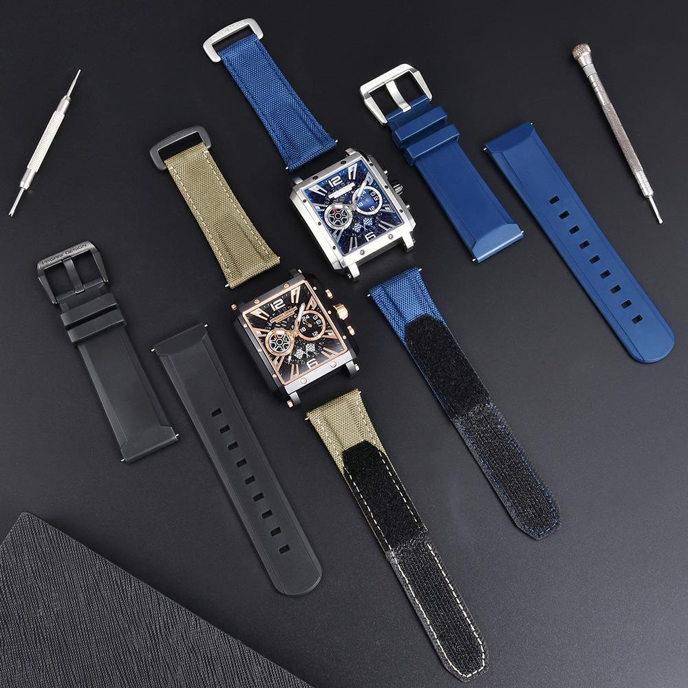 Collection of watches with interchangeable straps on a dark surface